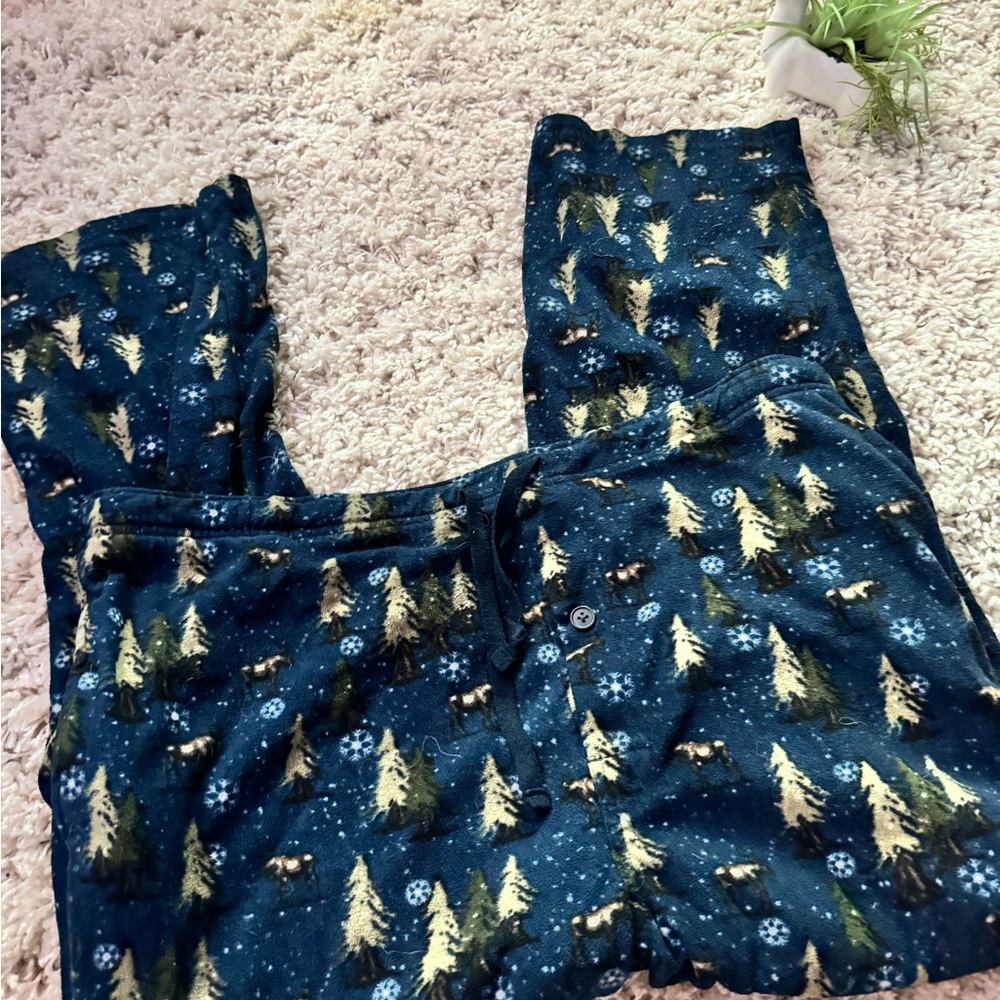 Navy blue and cream winter pj pants with a soft and cozy feel, tree des…